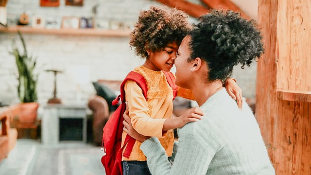 first day of school tradition between mother and daughter