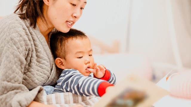 a mom doing her bedtime routine for kids with a baby