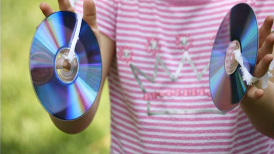 picture of little girl using homemade CD symbols