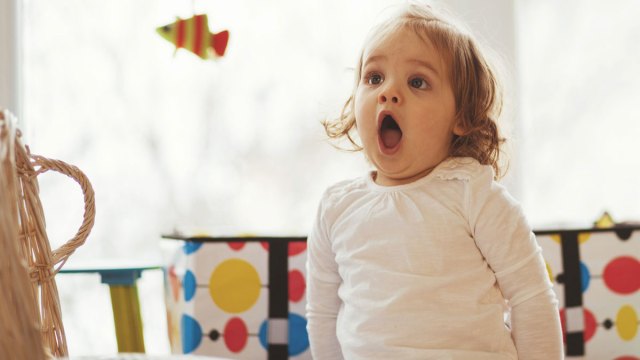a picture of a little girl looking surprised at 2024 baby names to avoid
