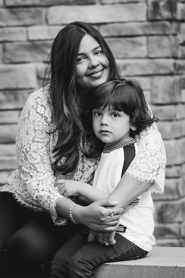 a professional photo of a mother with her son dressed in a lace blouse, one of the best family photo outfit ideas