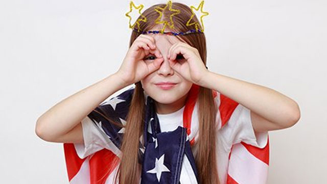 a picture of a little girl wearing fourth of july crafts 