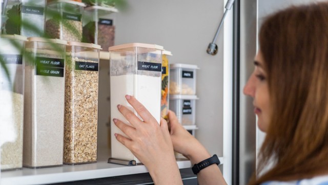 a woman using kitchen organization hacks