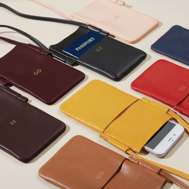 set of leather crossbody phone and passport holders