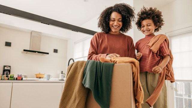 mom sending used kids' clothes to an online consignment shop