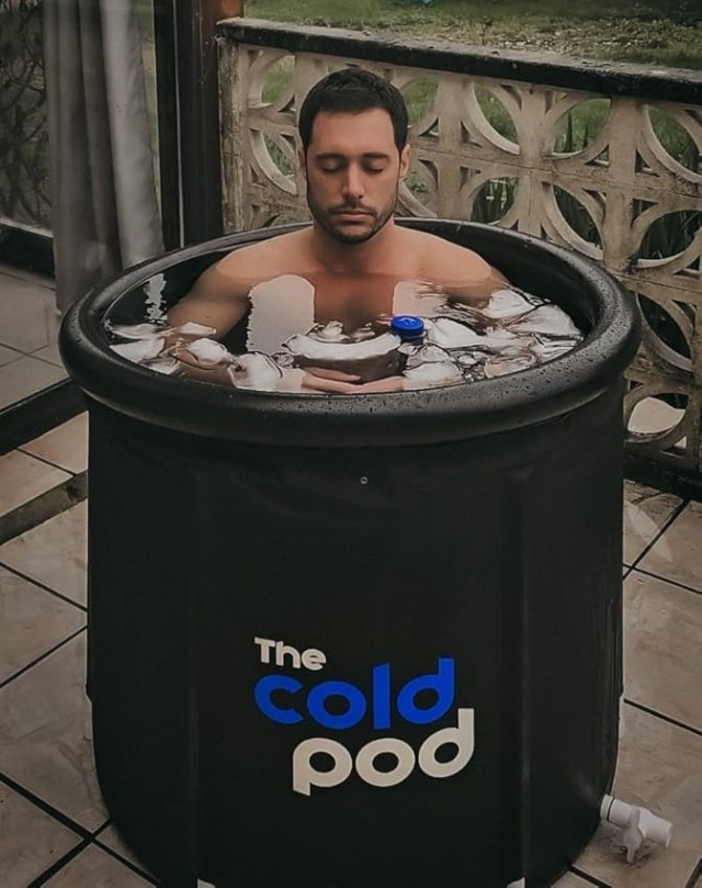 person relaxing in cold pod