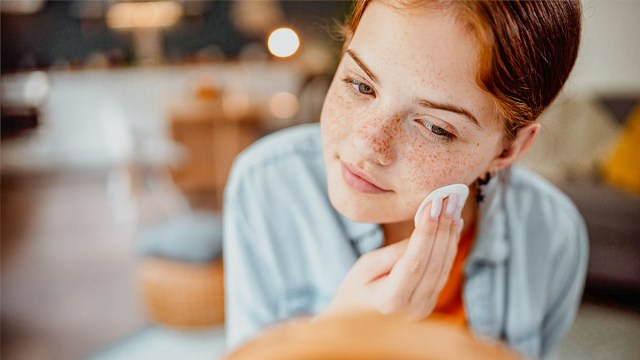 a girl using skincare products for tweens