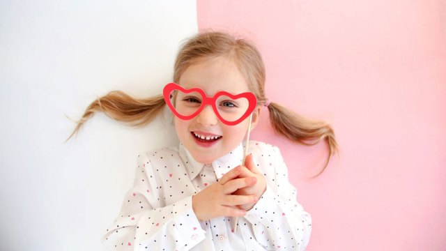 little girl laughing at Valentine's Day Jokes for Kids