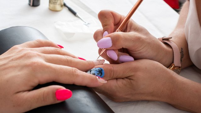 woman getting a salon manicure