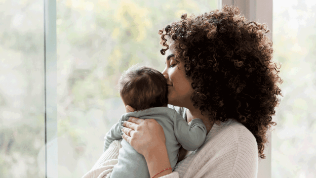 mom snuggling baby