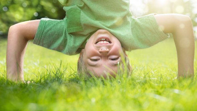 happy boy laughing at spring jokes